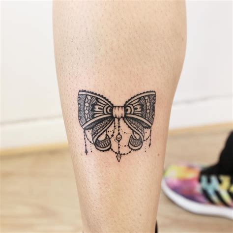 back of leg bow tattoo|black and white bow tattoos.